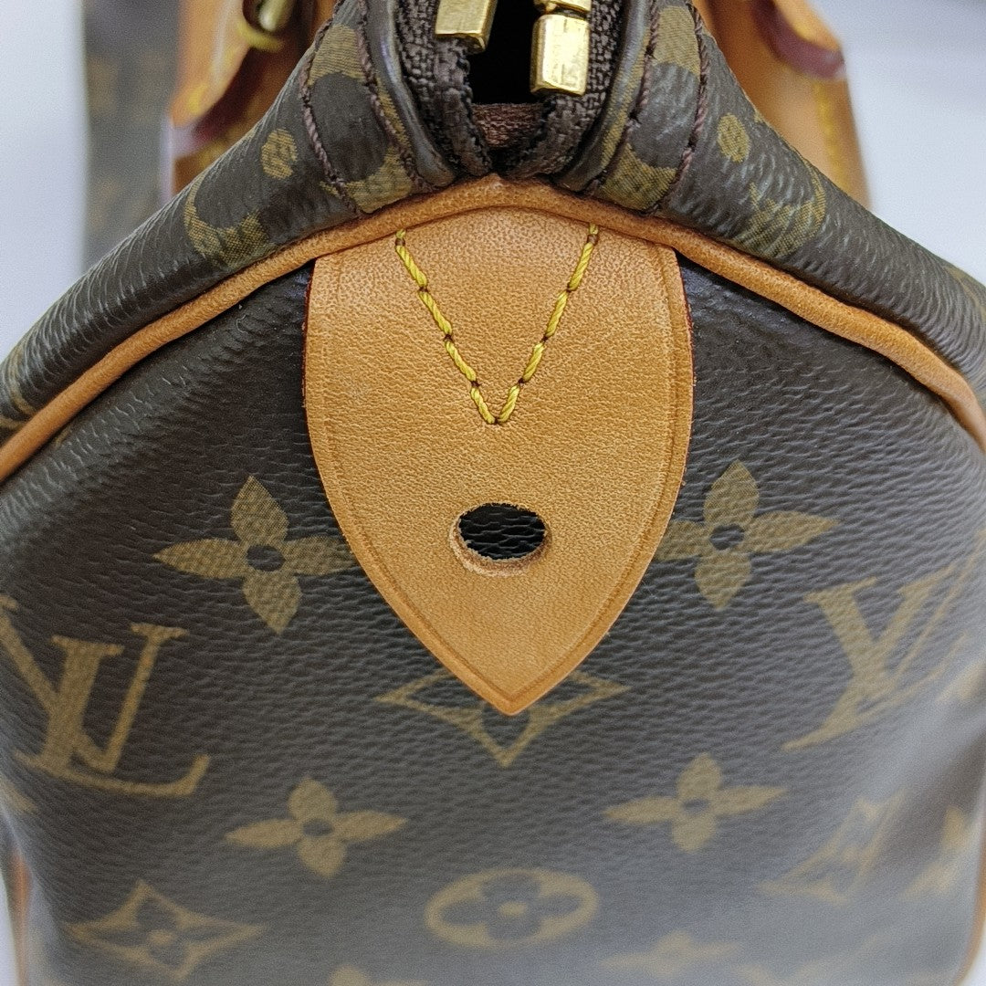 SPEEDY 25 Monogram Coated Canvas Brown