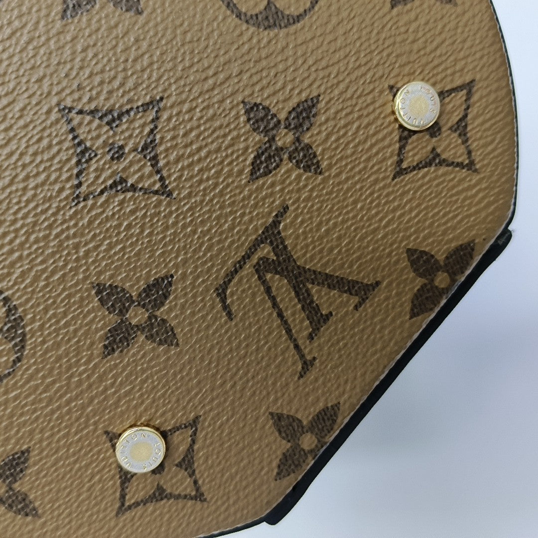 CANNES PM Monogram Coated Canvas Brown