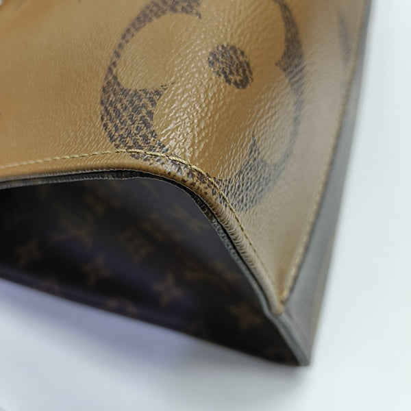 ONTHEGO MM Monogram Coated Canvas Brown