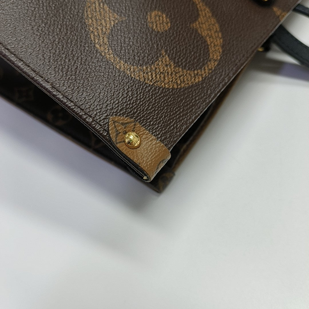 ONTHEGO GM Monogram Coated Canvas Brown