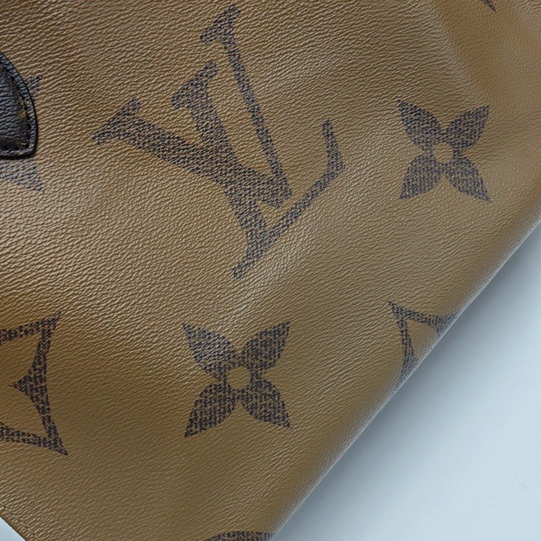 ONTHEGO MM Monogram Coated Canvas Brown