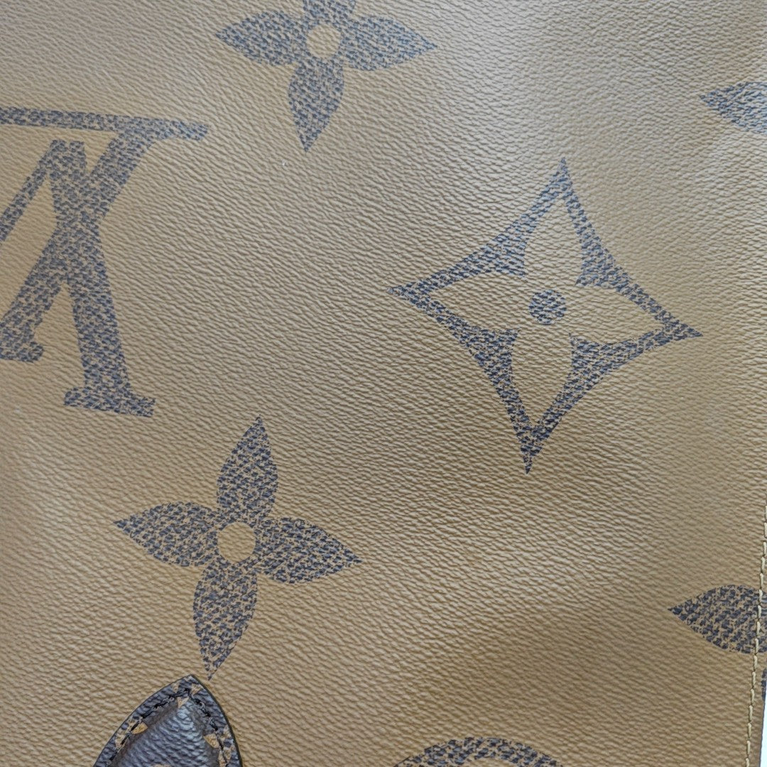 ONTHEGO GM Monogram Coated Canvas Brown