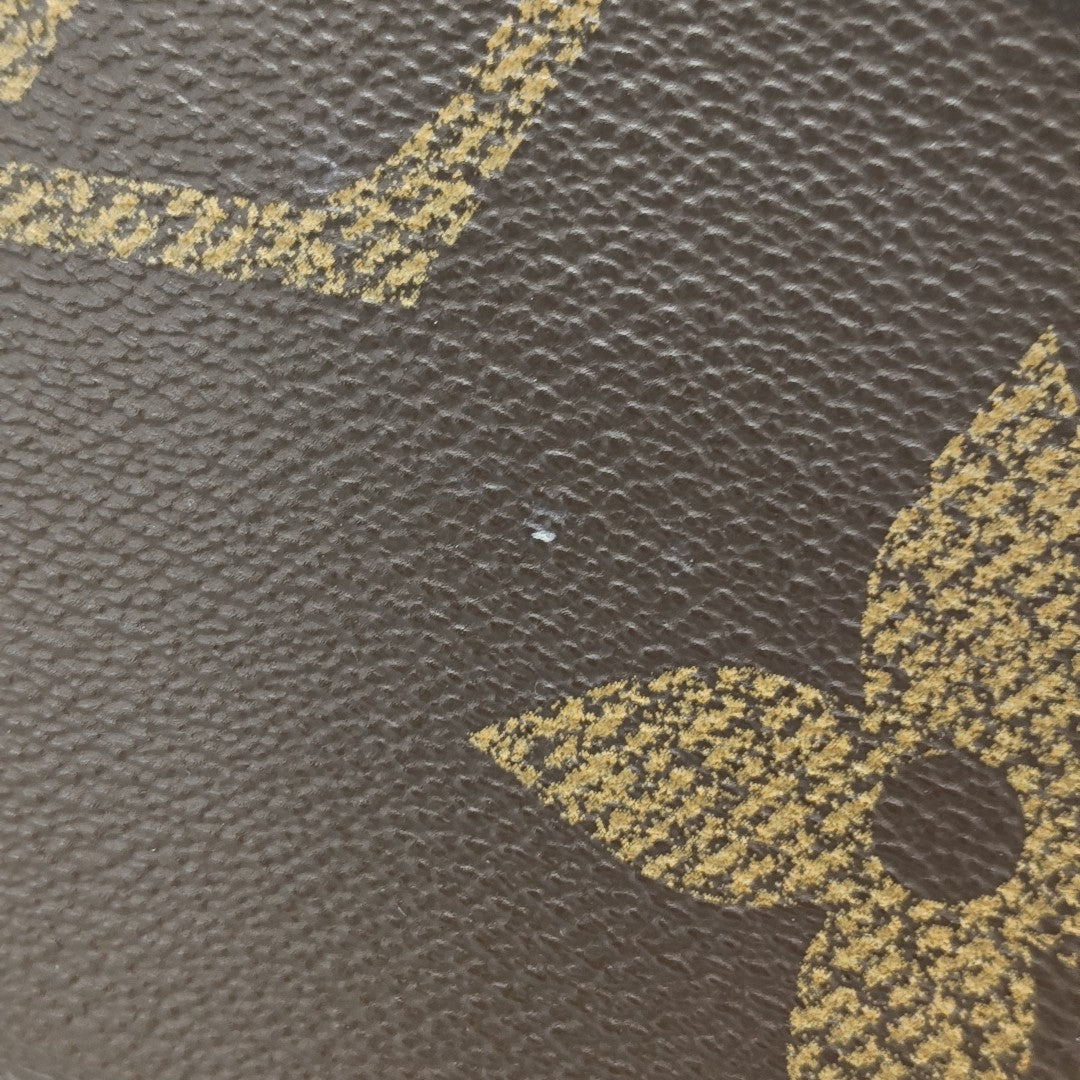 ONTHEGO MM Monogram Coated Canvas Brown
