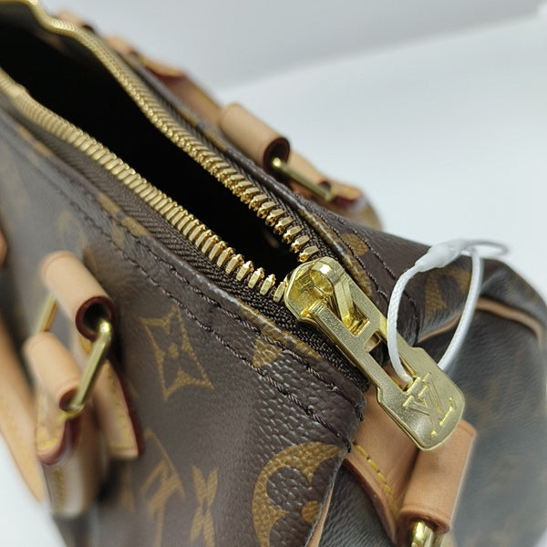 SPEEDY 25 Monogram Coated Canvas Brown