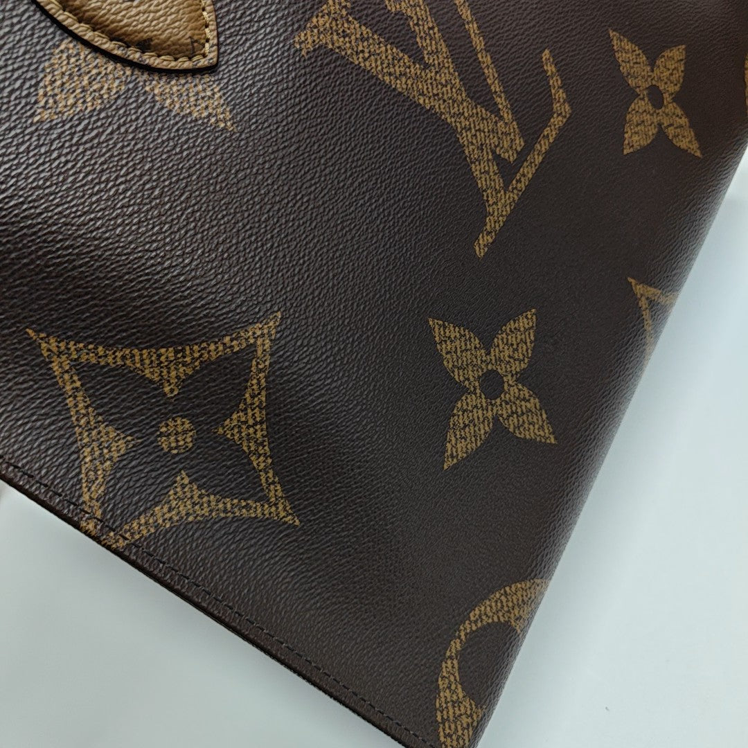 ONTHEGO MM Monogram Coated Canvas Brown