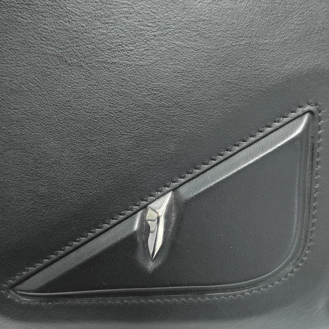 Authenticated pre-owned  Monster Calfskin Black - Clutch at Looply