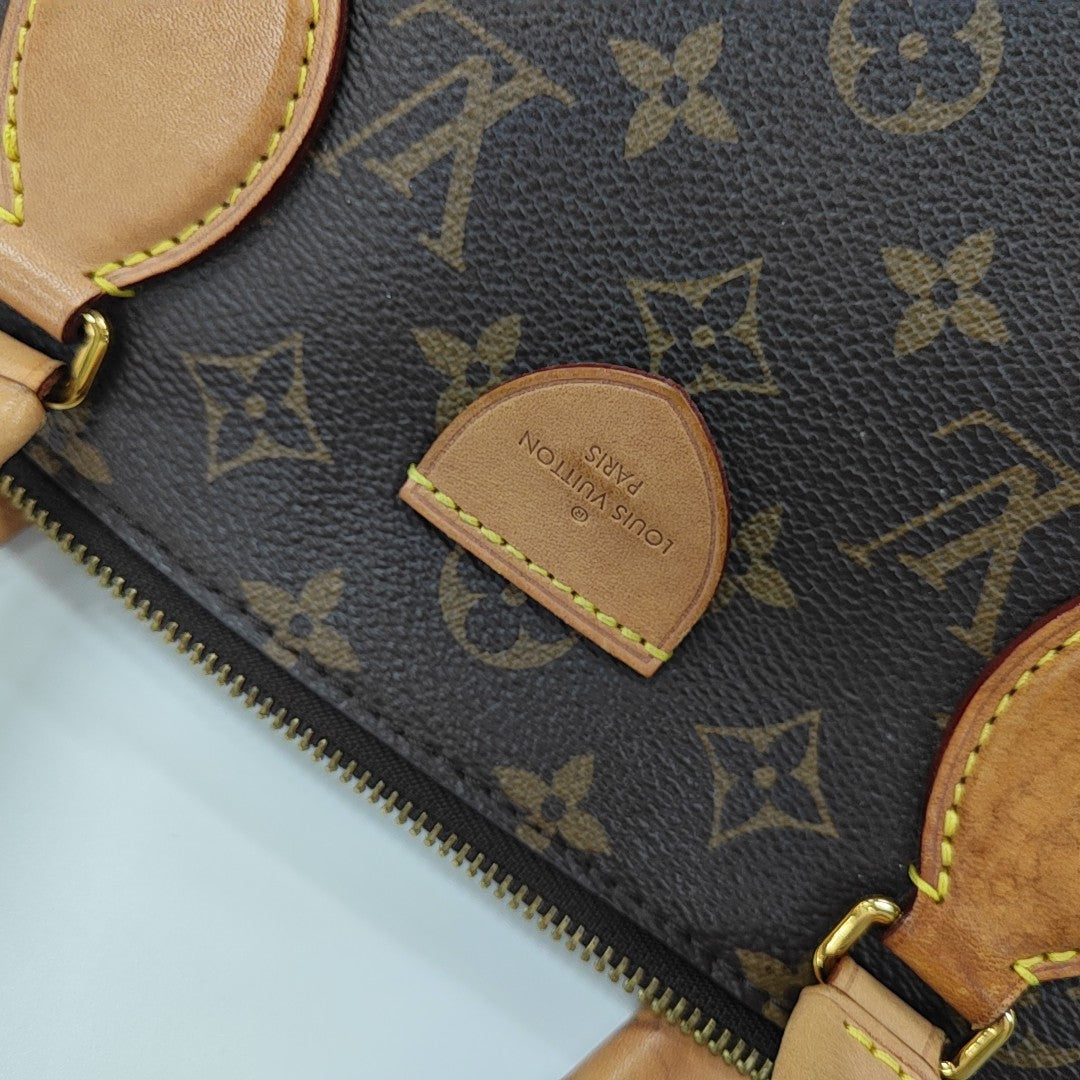 RIVOLI MM Monogram Coated Canvas Brown