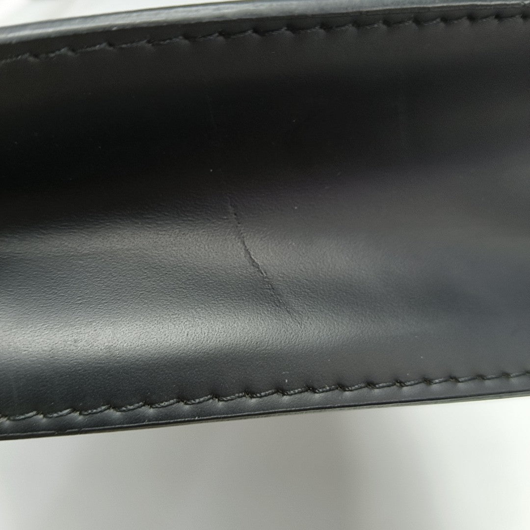 Pochette Voyag MM Monogram Coated Canvas Black