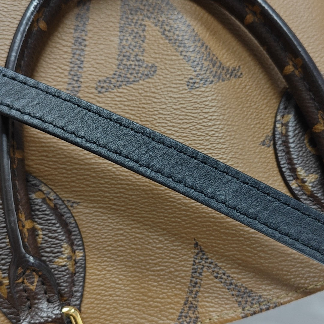 ONTHEGO MM Monogram Coated Canvas Brown