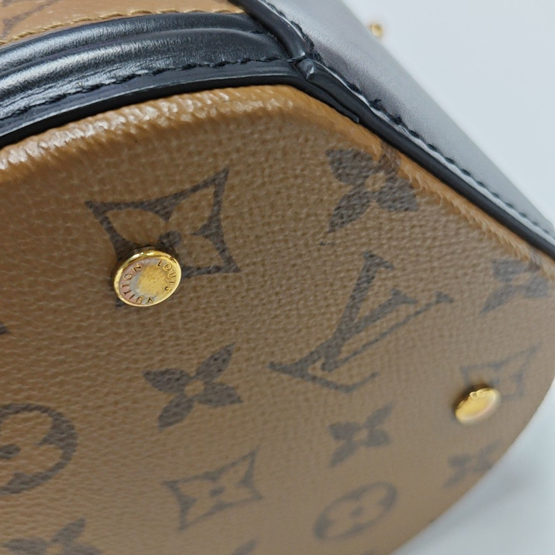 CANNES PM Monogram Coated Canvas Brown