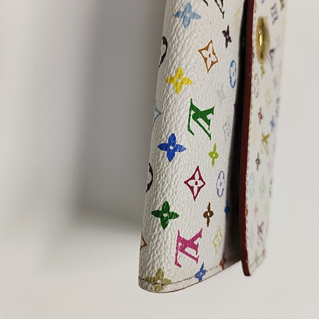 Monedero Monogram en lona revestida blanca