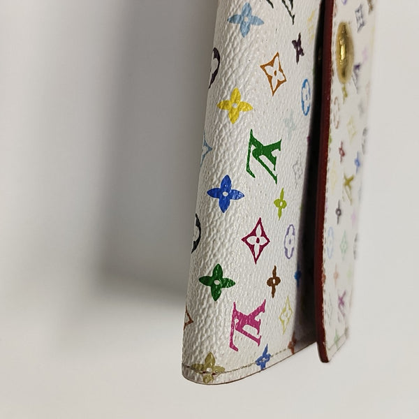 Monedero Monogram en lona revestida blanca