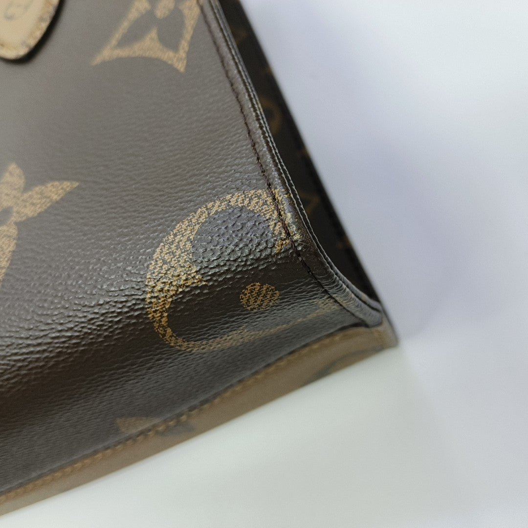 ONTHEGO PM Monogram Coated Canvas Brown