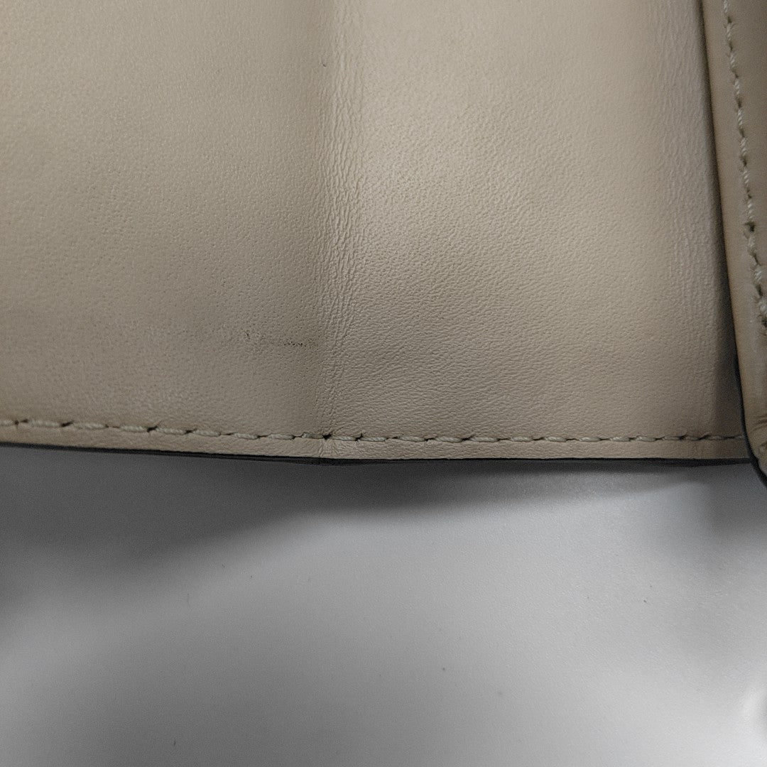 TRUNK Monogram Coated Canvas Brown