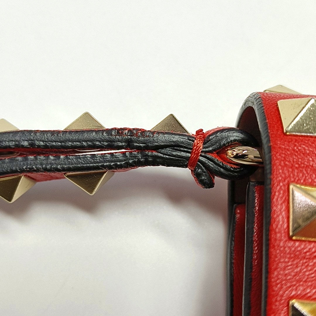 Authenticated pre-owned  Rockstud Lambskin Red - Clutch at Looply