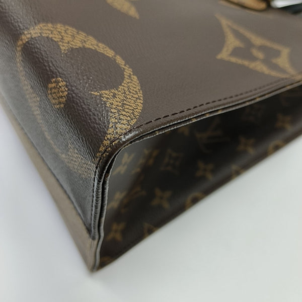 ONTHEGO MM Monogram Coated Canvas Brown