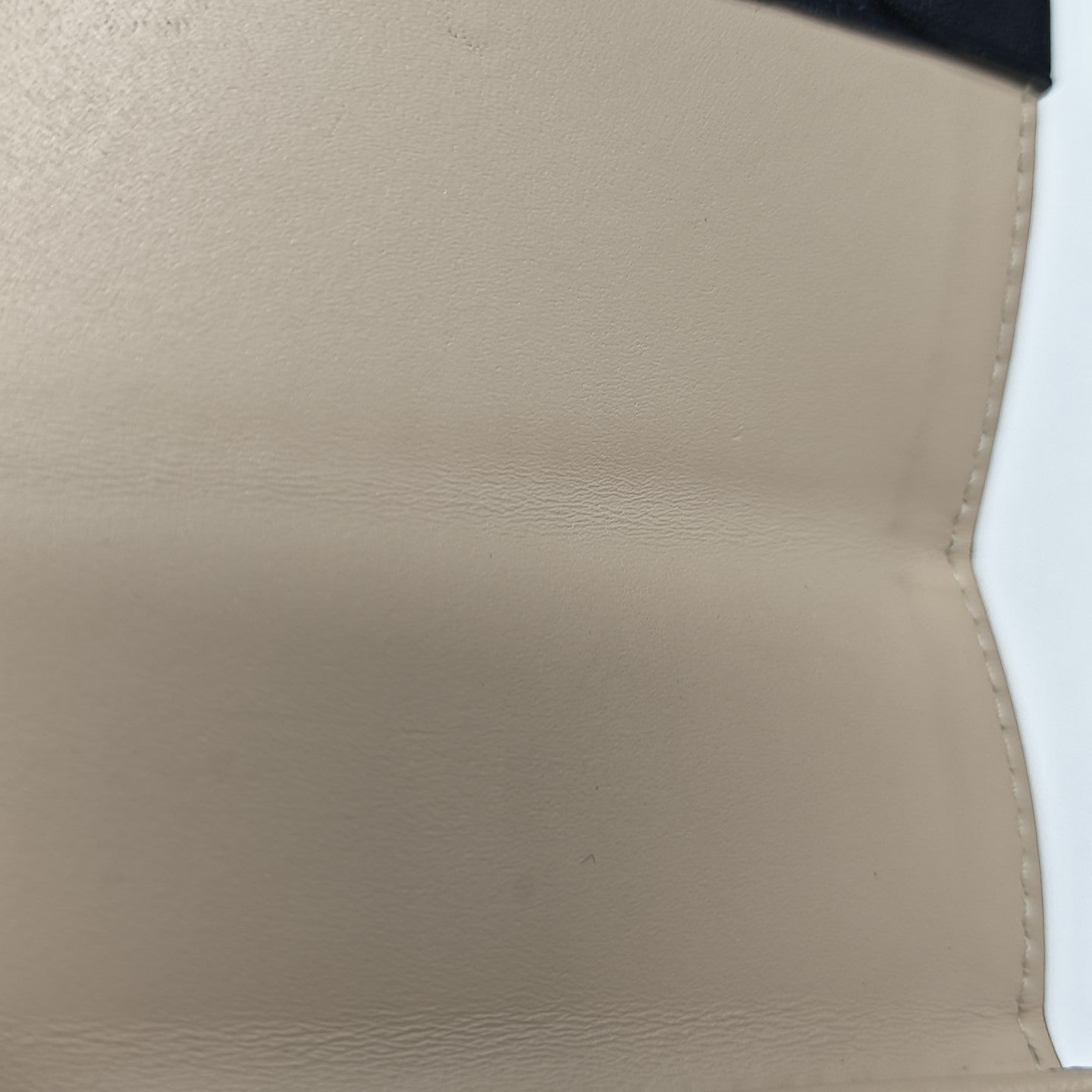 TRUNK Monogram Coated Canvas Brown