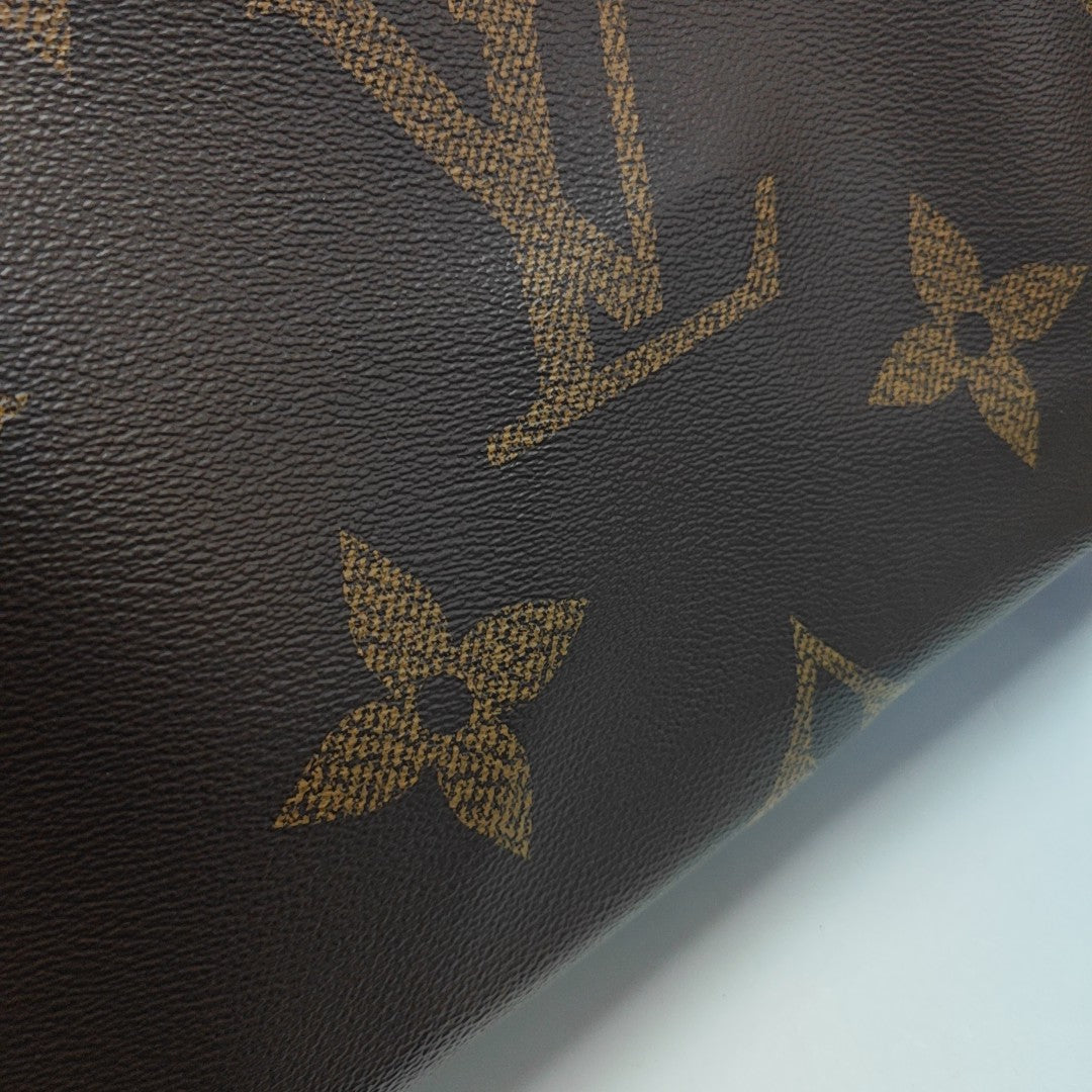 ONTHEGO MM Monogram Coated Canvas Brown