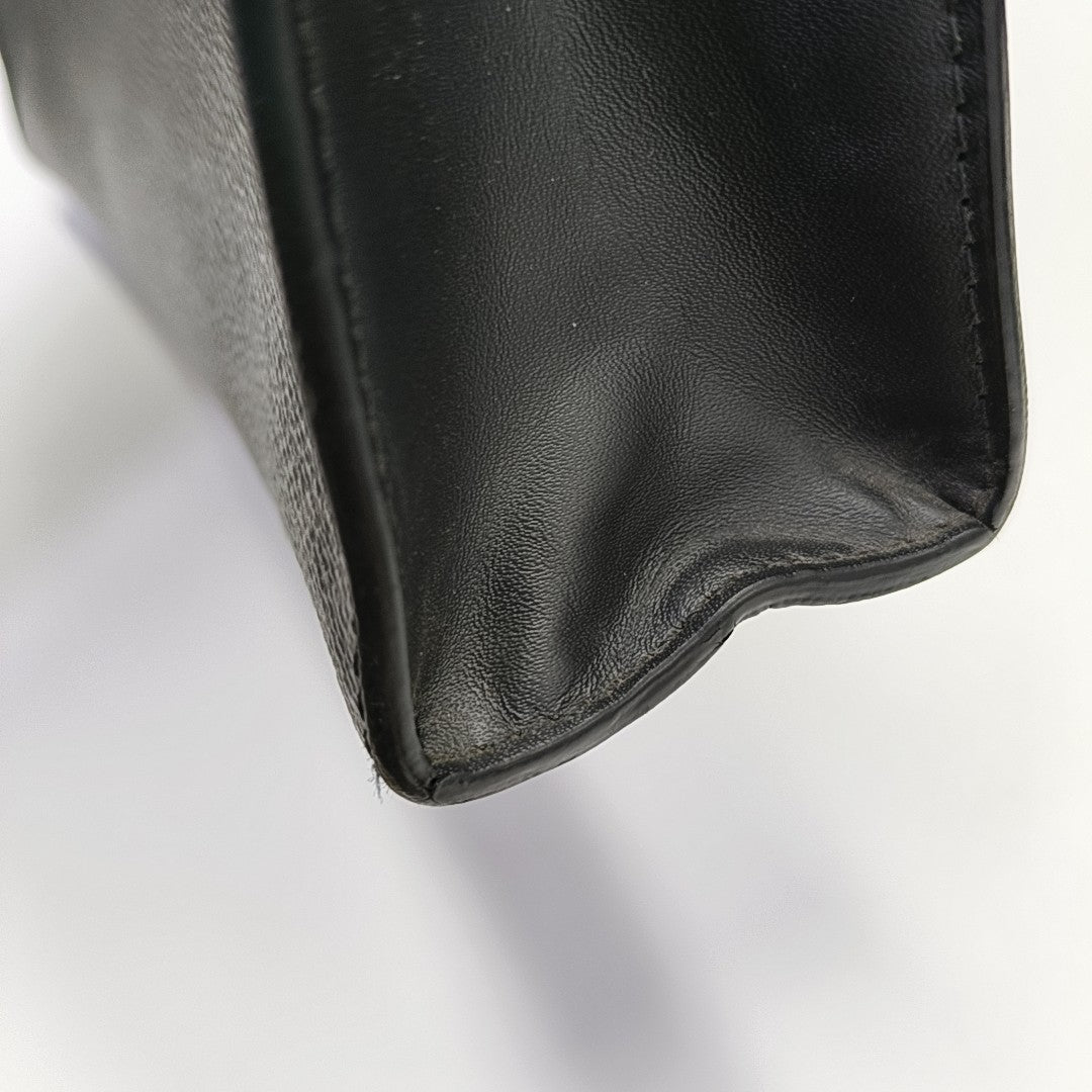 Pochette Voyag MM Monogram Coated Canvas Black