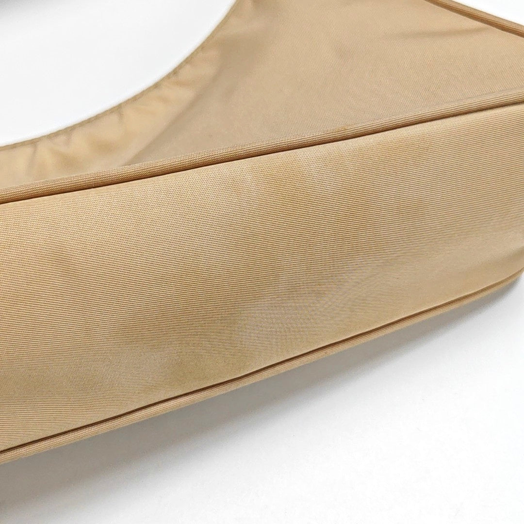 Authenticated pre-owned  Re-Edition2000 Mini Nylon Beige - Top Handle Bag at Looply