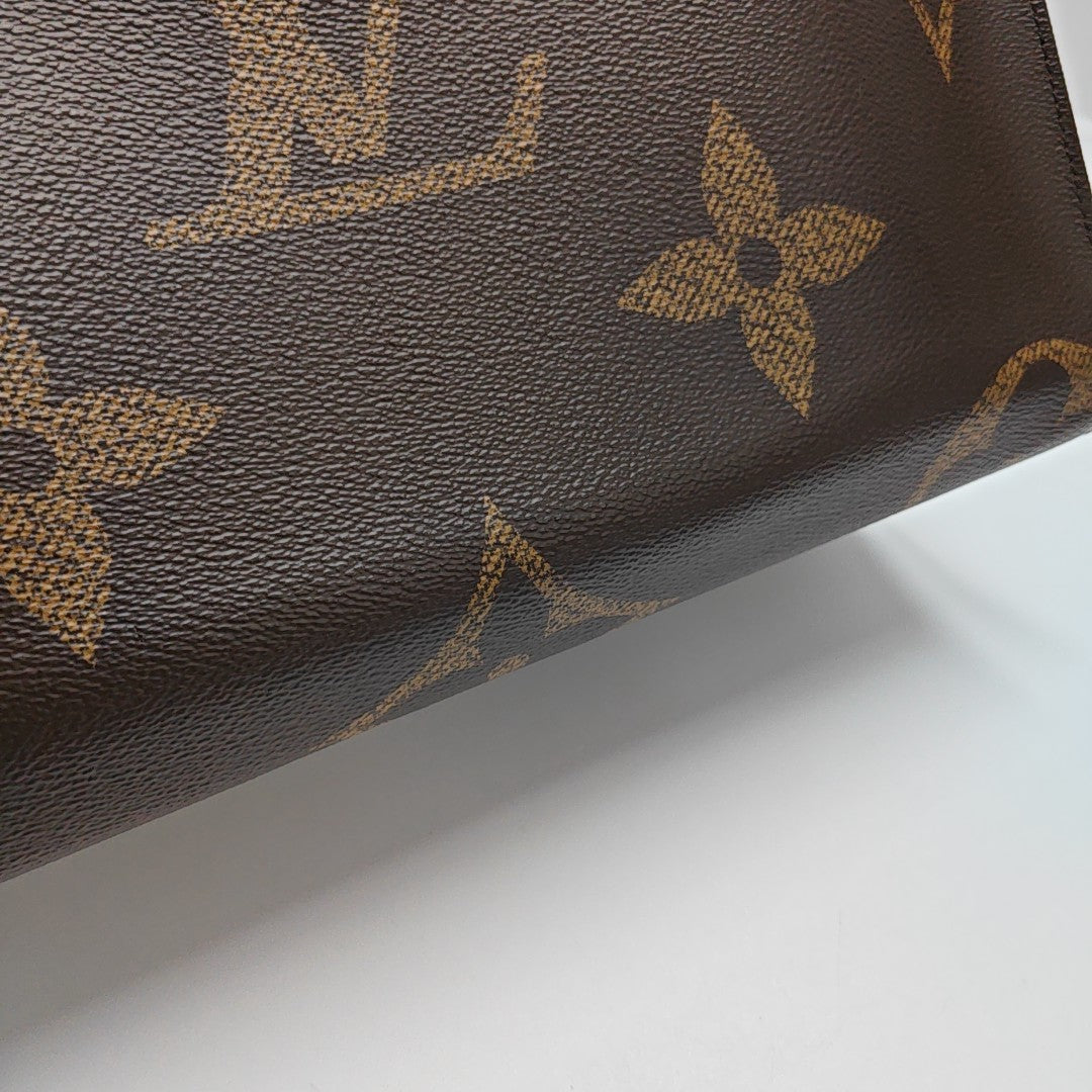 ONTHEGO MM Monogram Coated Canvas Brown