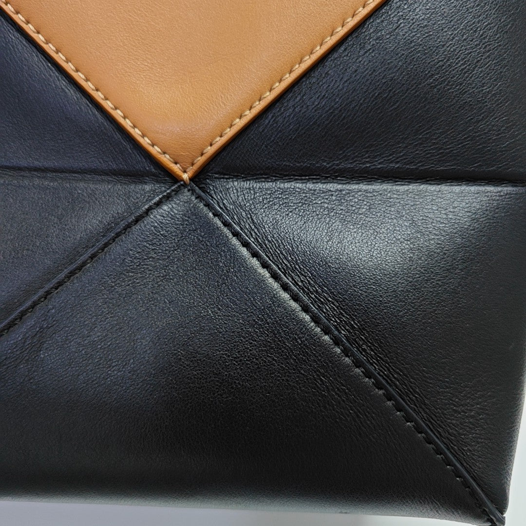 Authenticated pre-owned  Puzzle Fold Mini Calfskin Black - Tote Bag at Looply