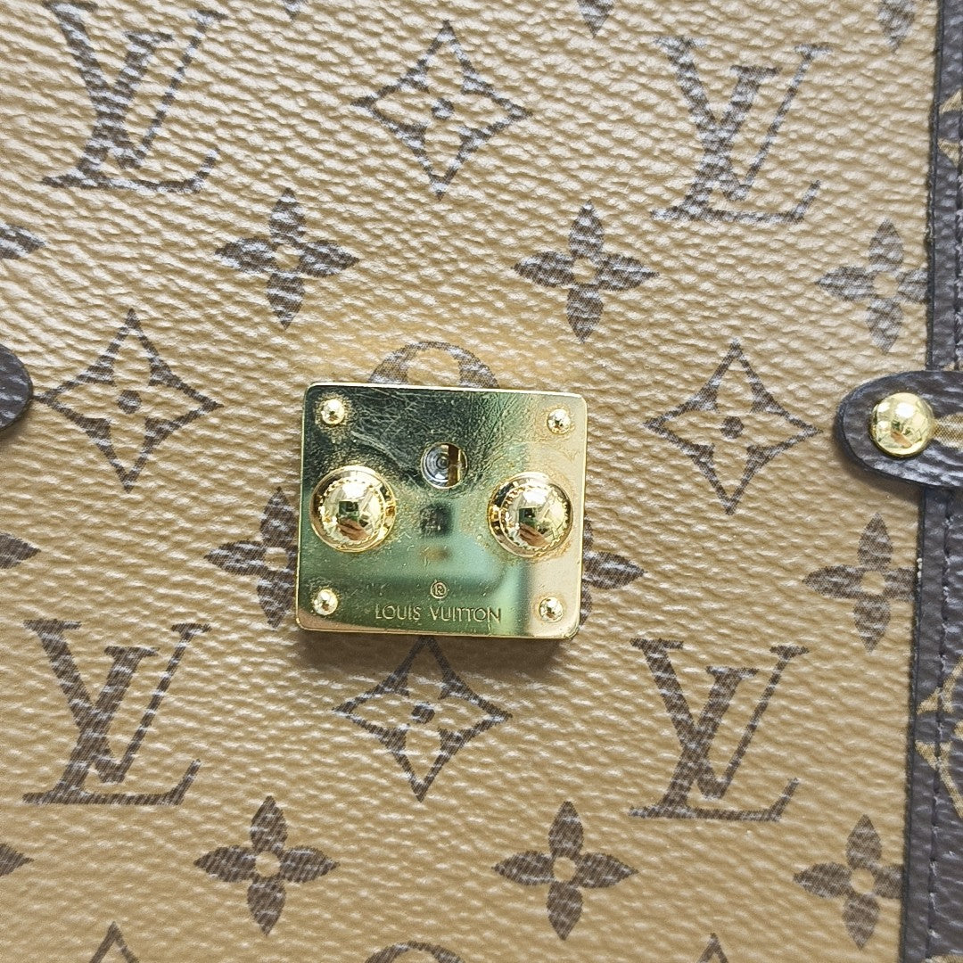 TRUNK Monogram Coated Canvas Brown