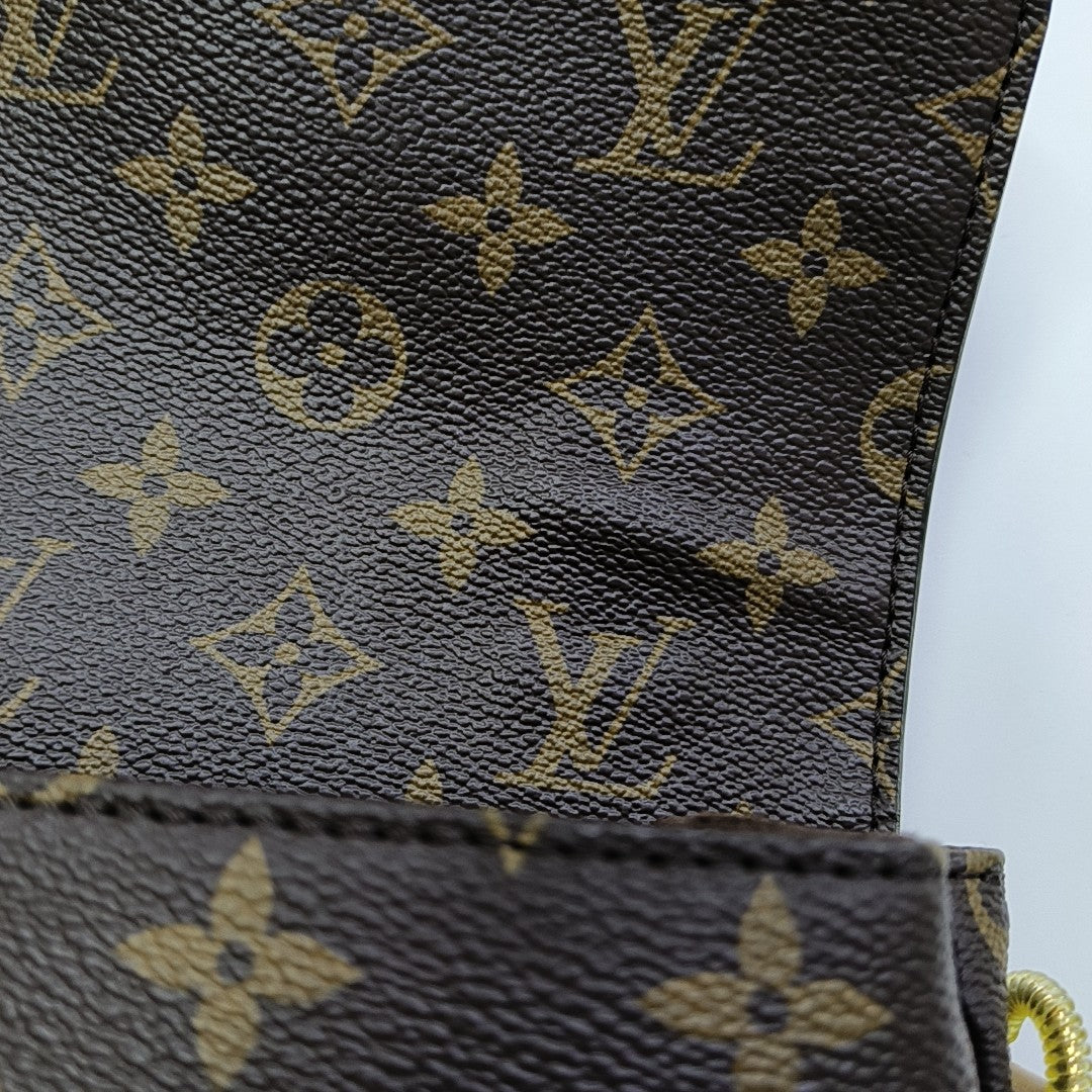 MÉTIS MM Monogram Coated Canvas Brown