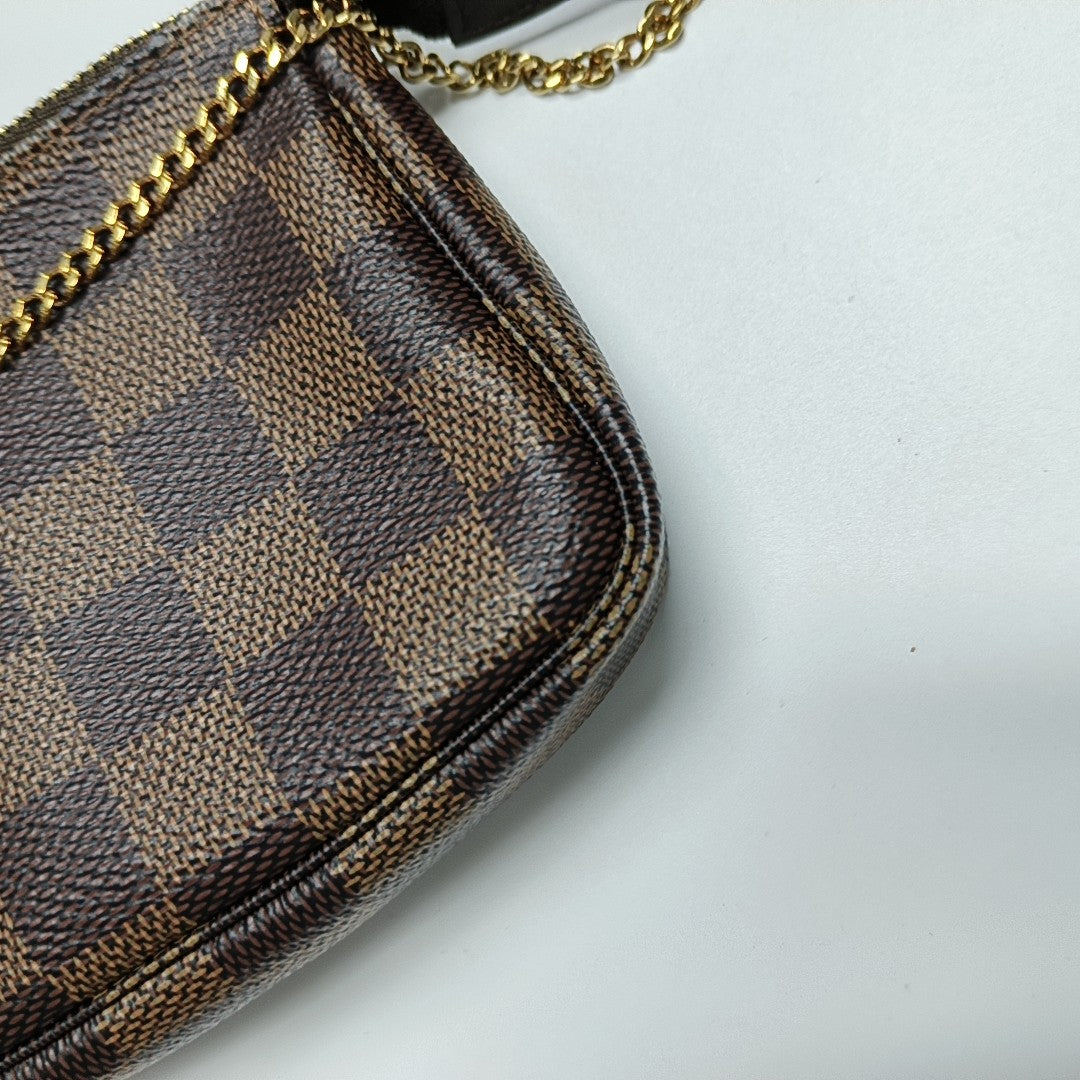 Authenticated pre-owned  ACCESSOIRES Mini Coated Canvas Brown - Top Handle Bag at Looply