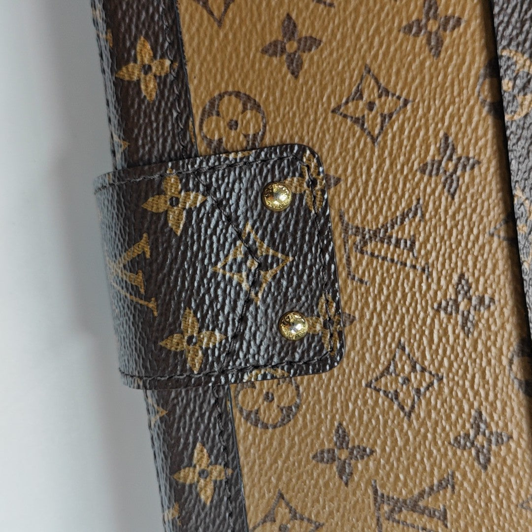 PETITE MALLE Monogram Coated Canvas Brown