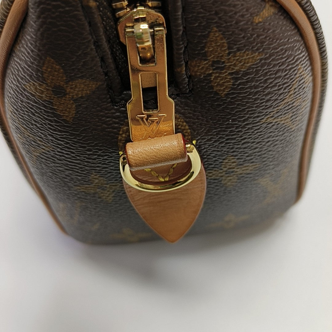 SPEEDY 20 Monogram Coated Canvas Brown