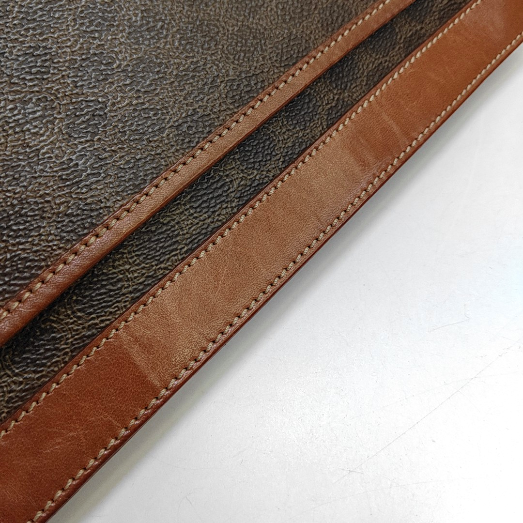 Authenticated pre-owned  MACADAM CLUTCHES Coated Canvas Brown - Clutch at Looply