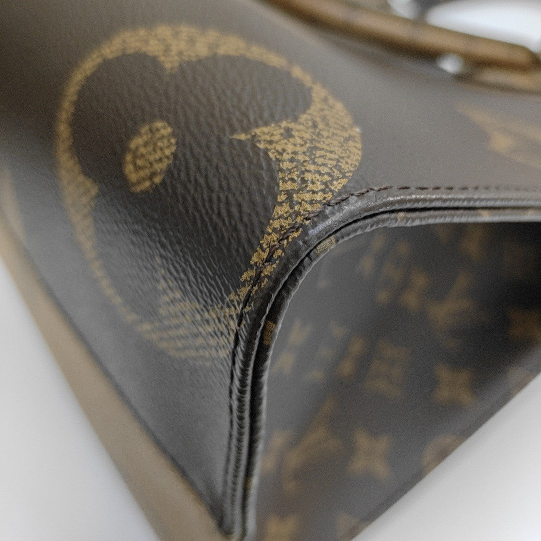 ONTHEGO MM Monogram Coated Canvas Brown
