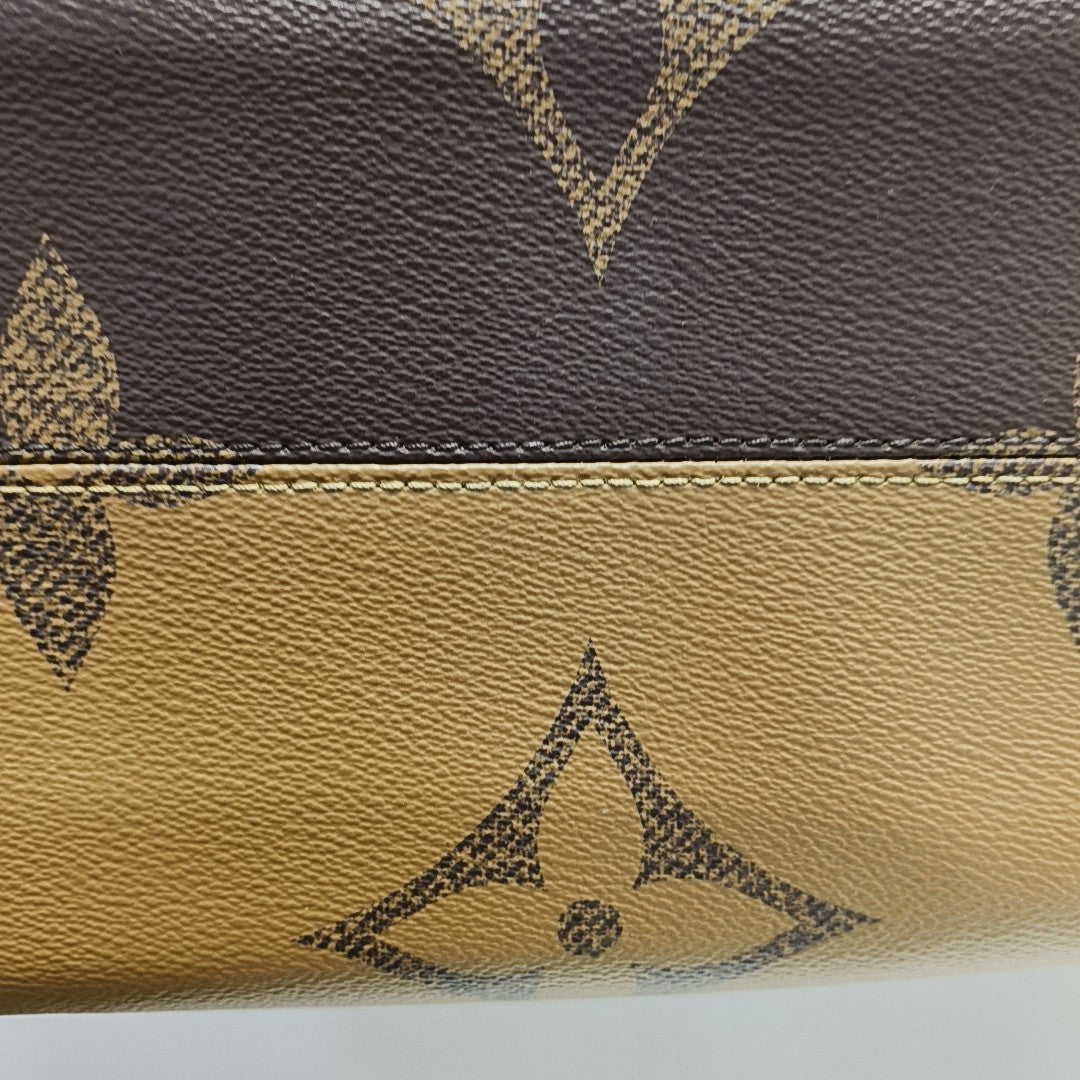 ONTHEGO MM Monogram Coated Canvas Brown