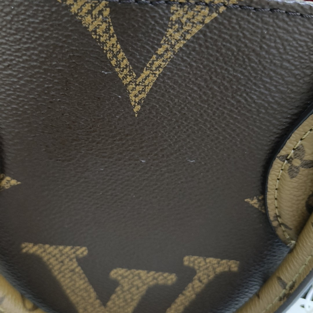 ONTHEGO MM Monogram Coated Canvas Brown