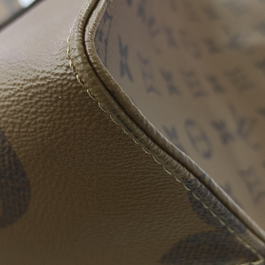 ONTHEGO GM Monogram Coated Canvas Brown