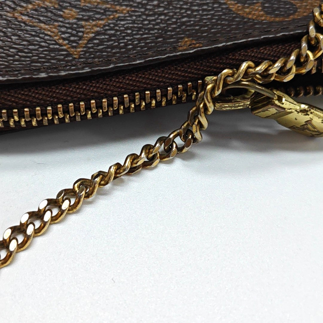 Authenticated pre-owned  ACCESSOIRES Mini Monogram Coated Canvas Brown - Top Handle Bag at Looply