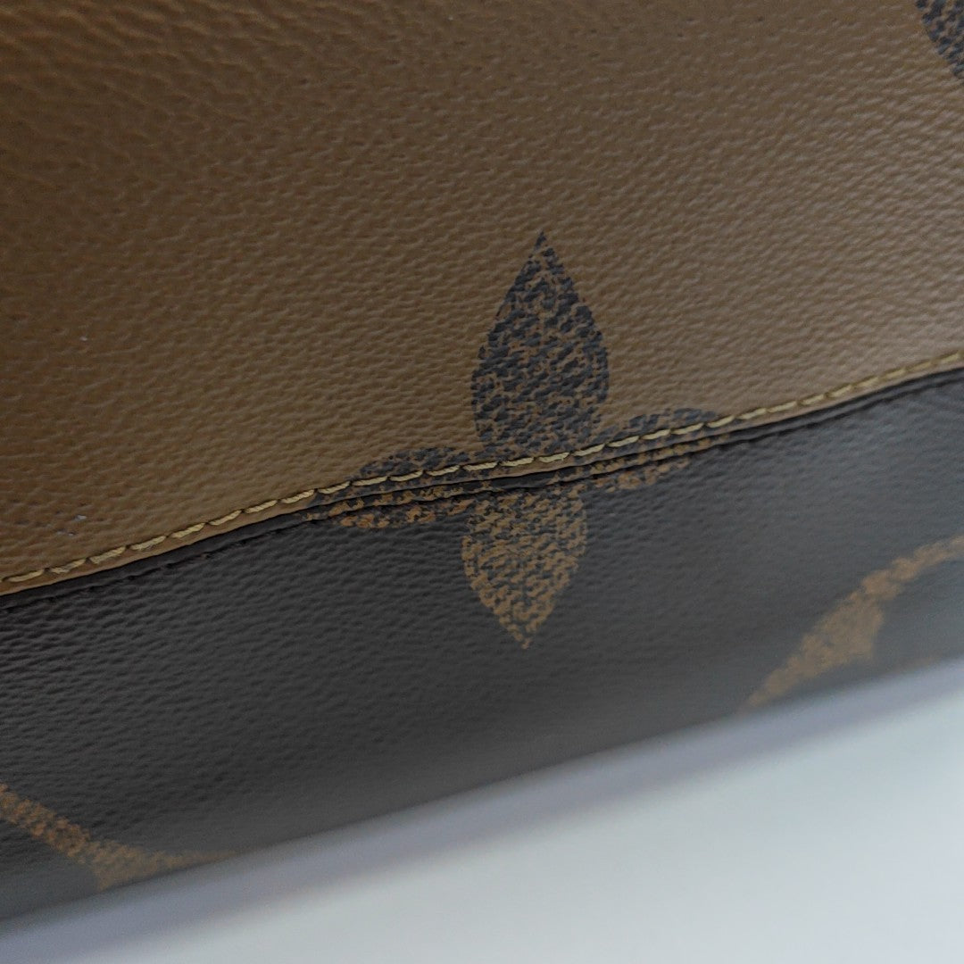 ONTHEGO MM Monogram Coated Canvas Brown