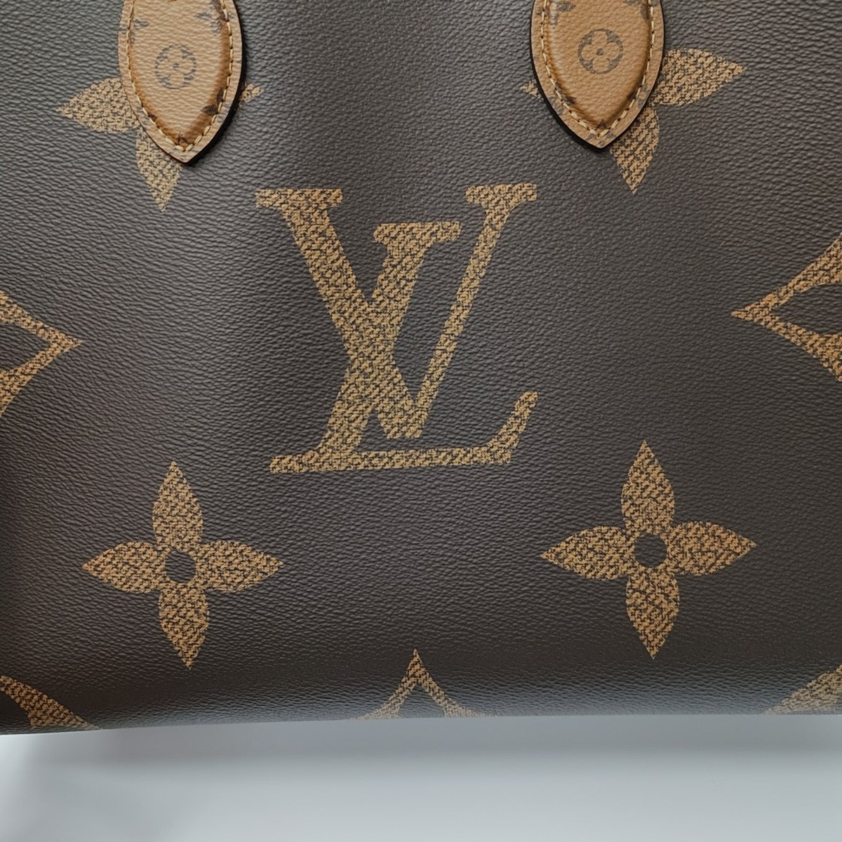 ONTHEGO MM Monogram Coated Canvas Brown