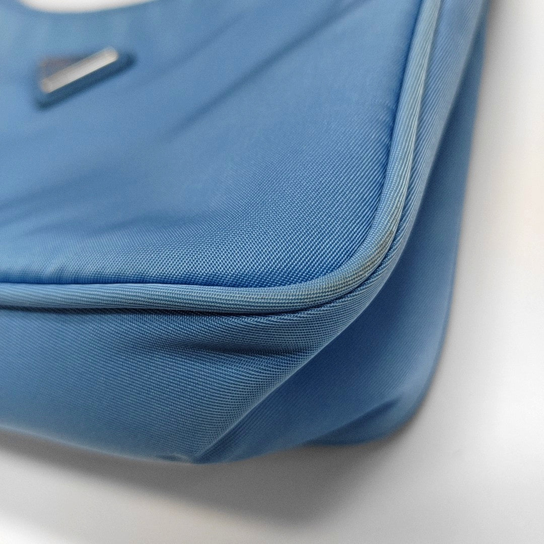 Authenticated pre-owned  Re-Edition2000 Mini Nylon Blue - Top Handle Bag at Looply