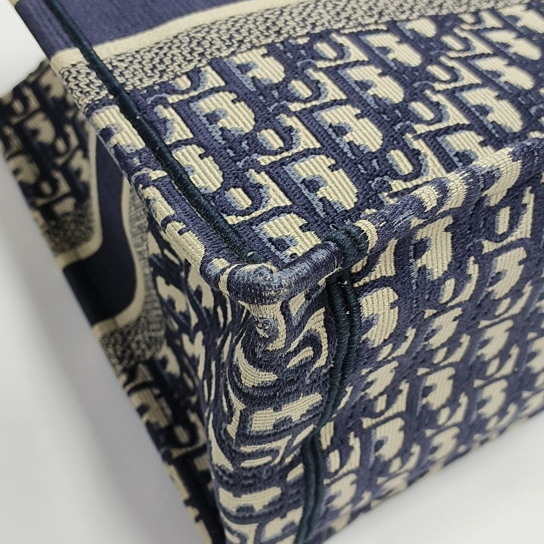 Authenticated pre-owned  Book Tote Medium Monogram Canvas Blue - Tote Bag at Looply
