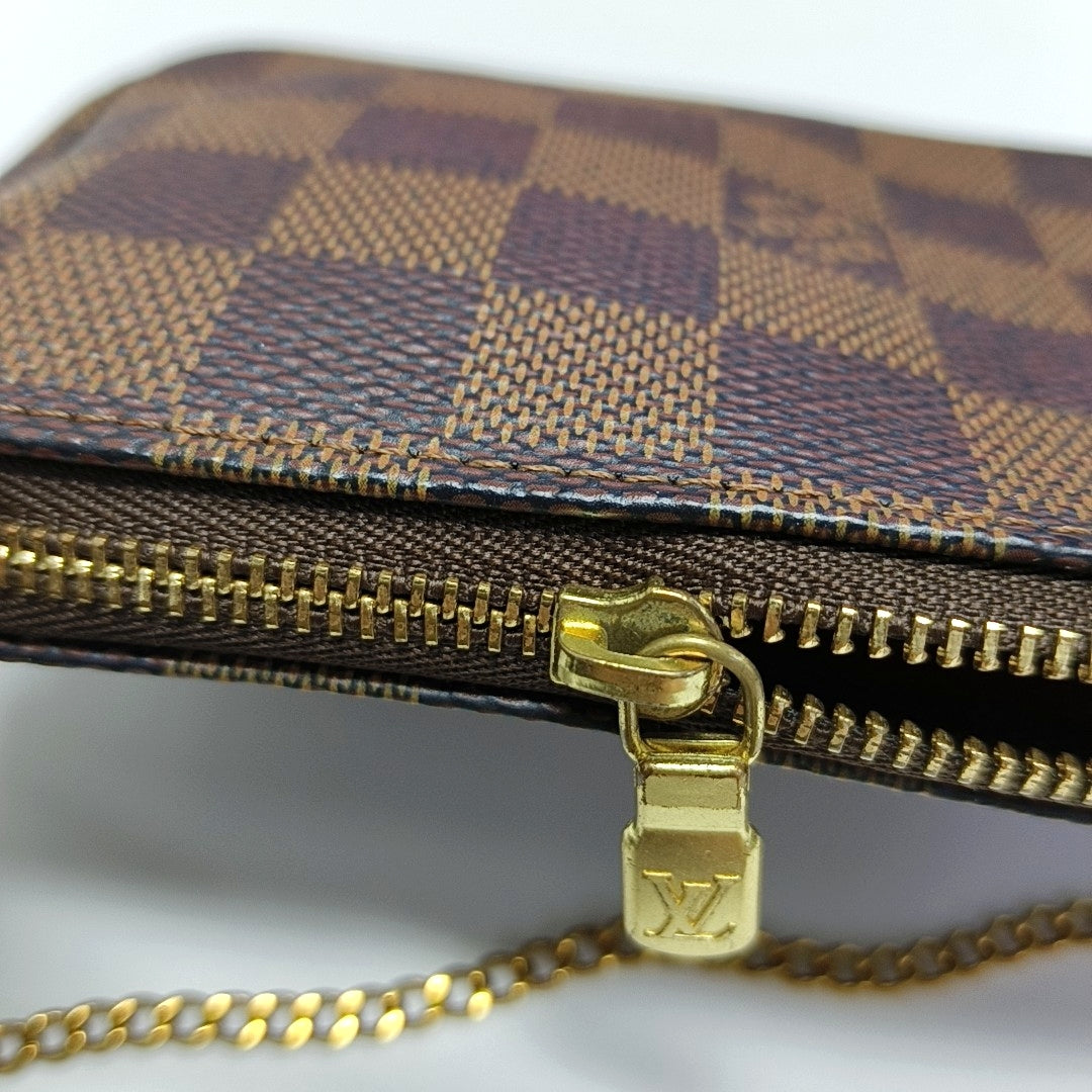 Authenticated pre-owned  ACCESSOIRES Mini Damier Ebene Coated Canvas Brown - Top Handle Bag at Looply