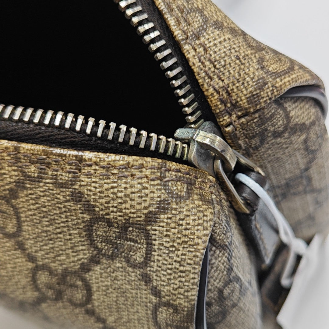 Monogram Coated Canvas Clutch Brown