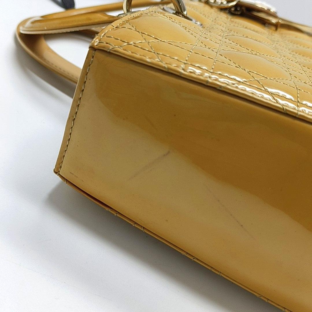 Authenticated pre-owned  Lady Dior Large Quilted Patent Leather Yellow - Tote Bag at Looply