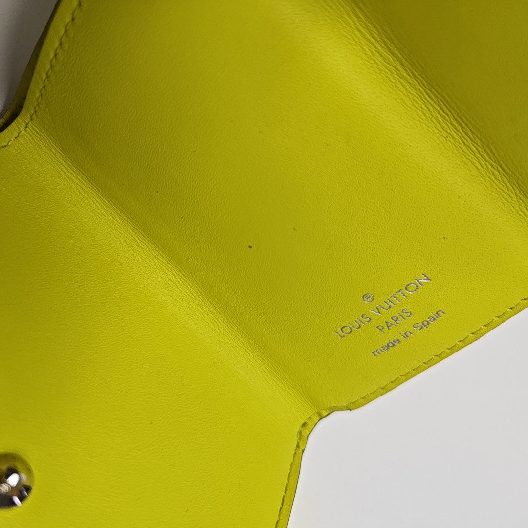 DISCOVERY Monogram Coated Canvas Yellow Card Holder