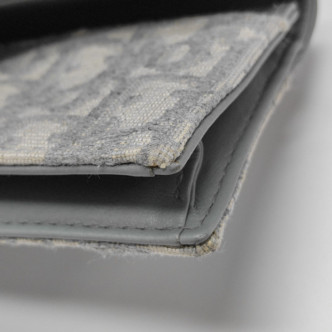 Authenticated pre-owned  Saddle Oblique Fabric Gray Card Holder - Card Holder at Looply