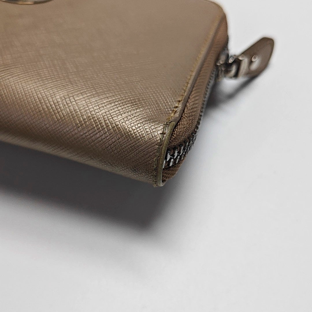 Authenticated pre-owned  Gancini Calfskin Beige Wallet - Wallet at Looply