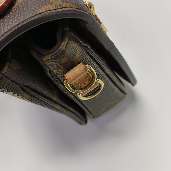 MÉTIS EAST WEST Monogram Coated Canvas Brown