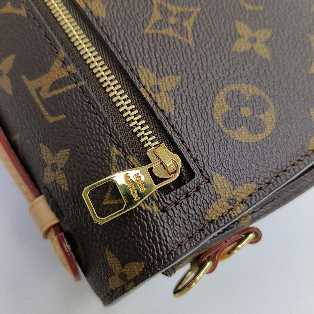 MÉTIS EAST WEST Monogram Coated Canvas Brown