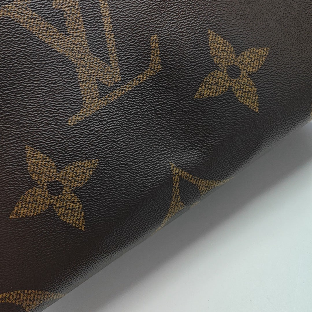 ONTHEGO MM Monogram Coated Canvas Brown